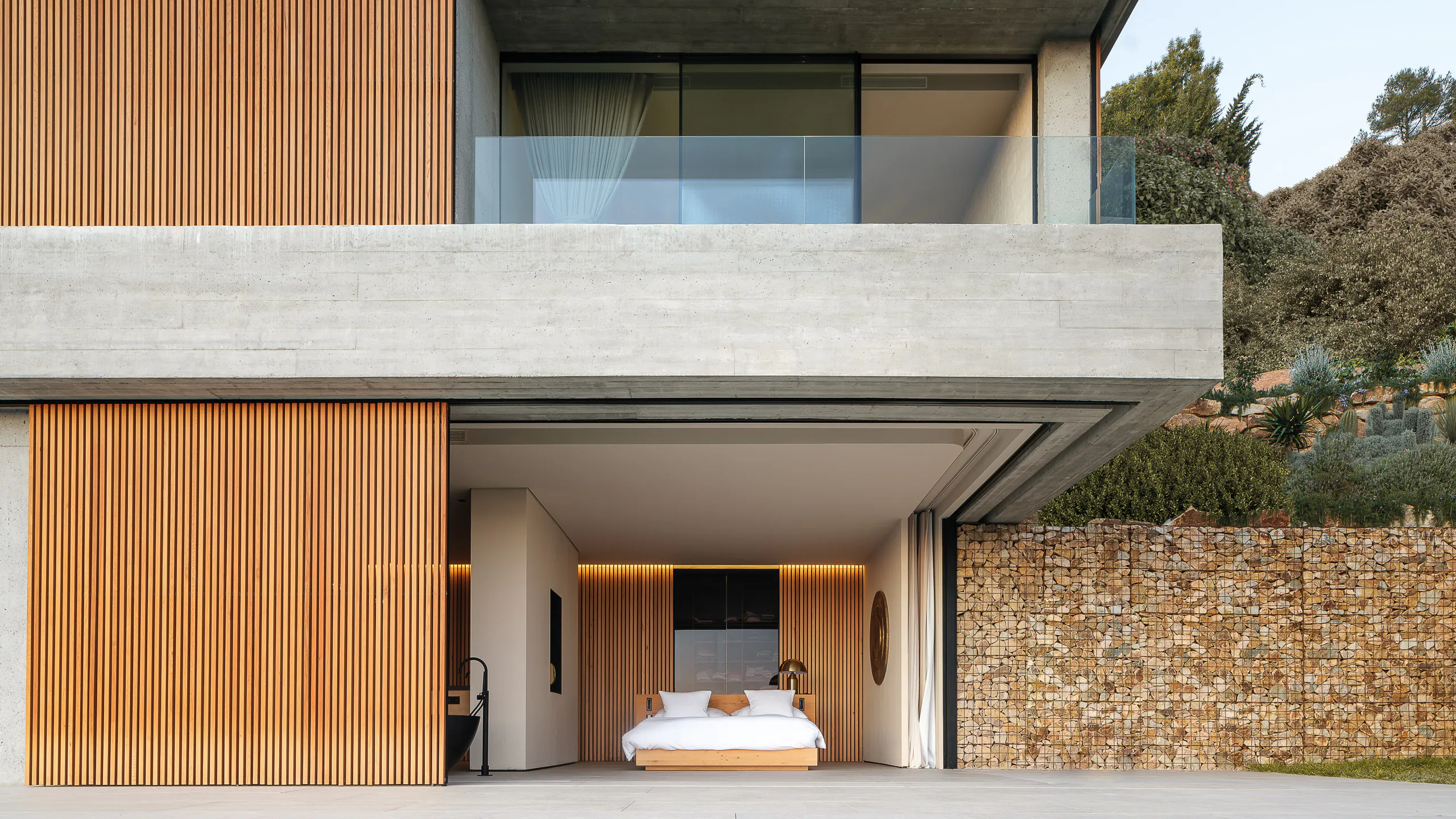Deeply shaded opening engineered into a hillside residence