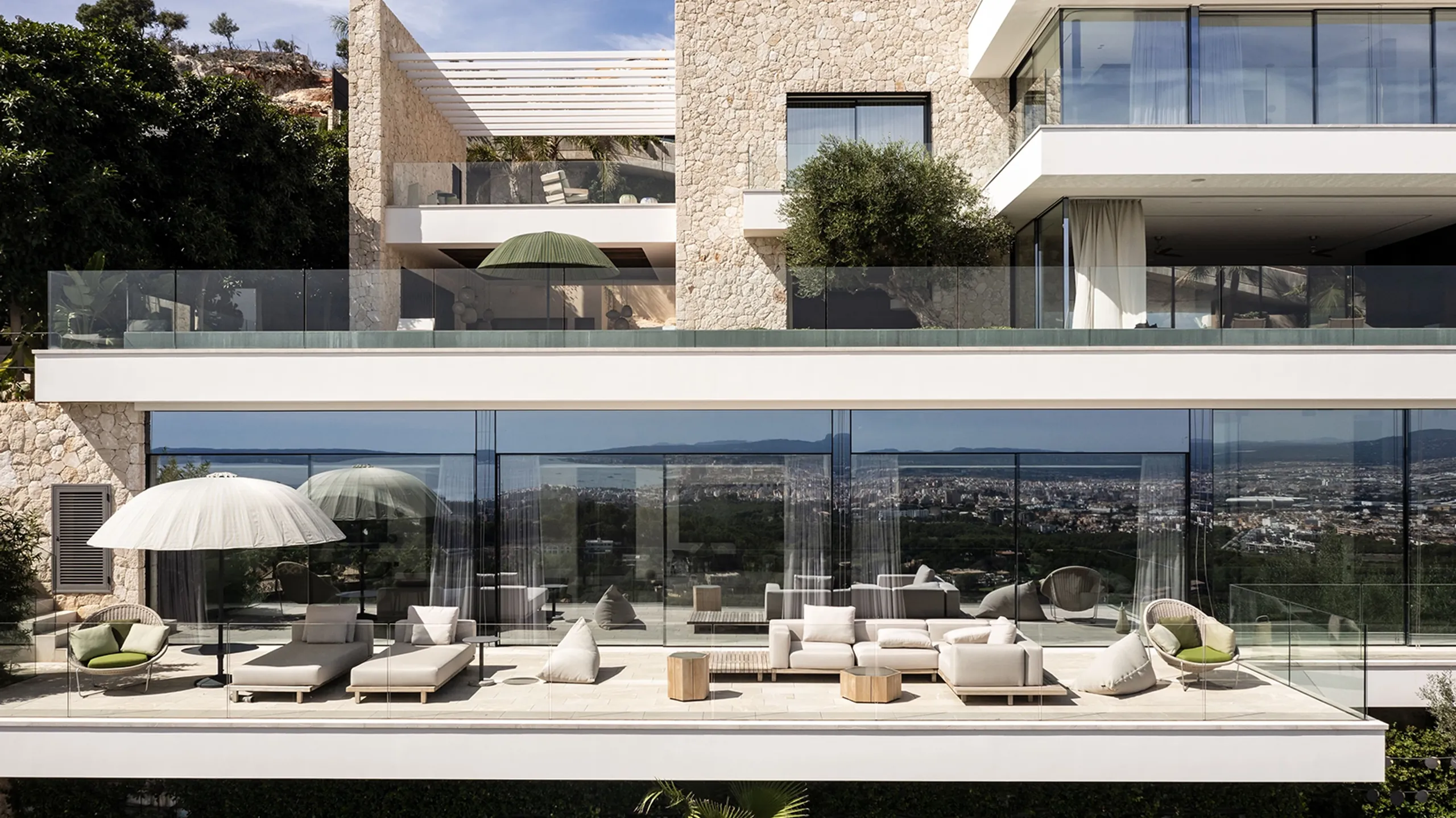 Open living room connected to a sheltered pool terrace