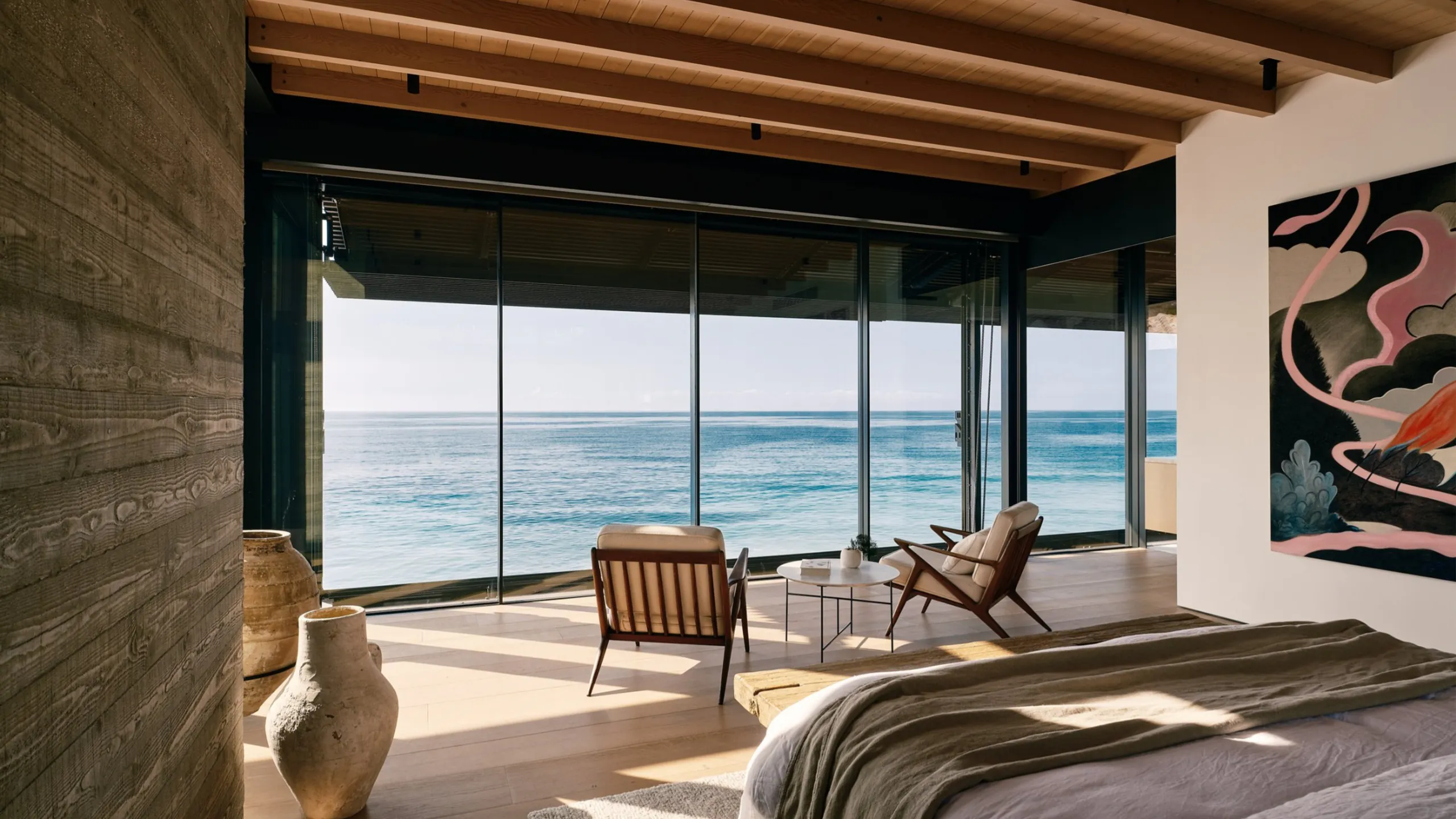 Oceanfront residence protected by broad architectural glazing and a deep roof